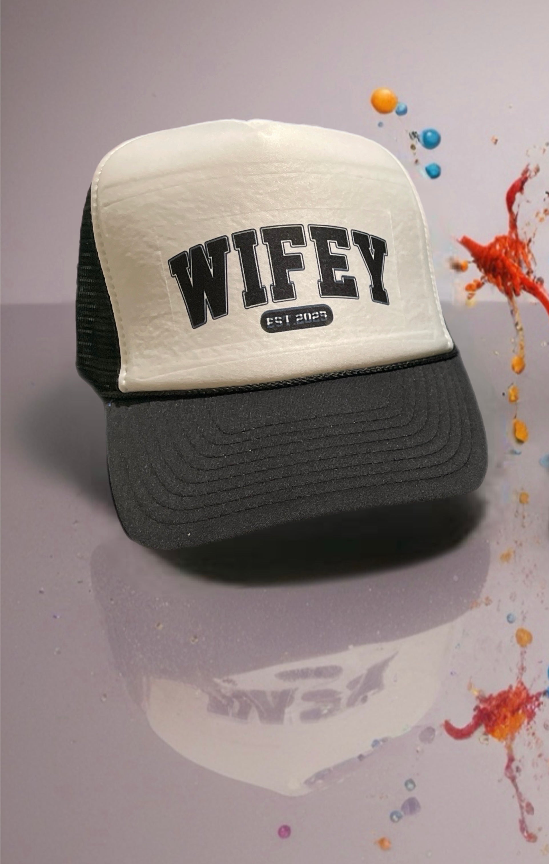 Trucker hat with 'WIFEY' text on a gray background