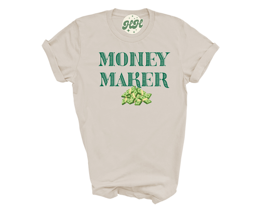 Beige t-shirt with 'Money Maker' text and green graphic on a white background
