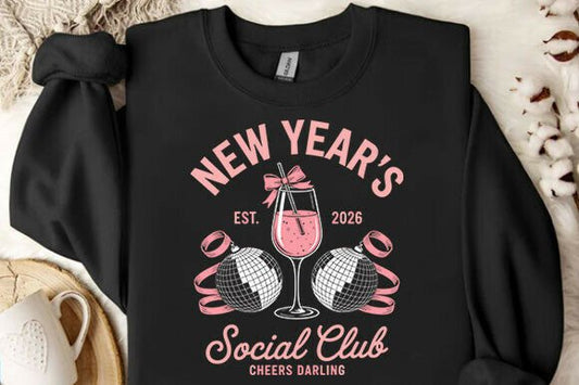 Black sweatshirt with New Year's design featuring a pink wine glass and text.