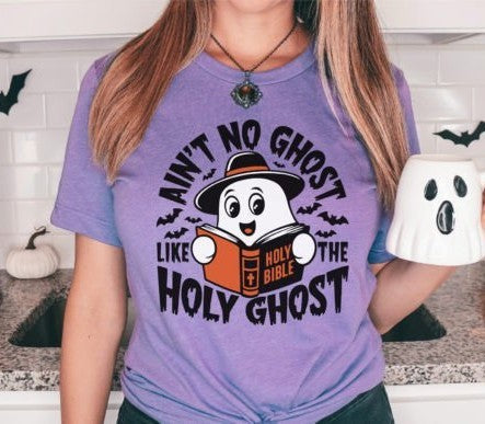 Purple Halloween shirt with cute cartoon ghost holding Holy Bible and text “Ain’t No Ghost Like the Holy Ghost” surrounded by bats
